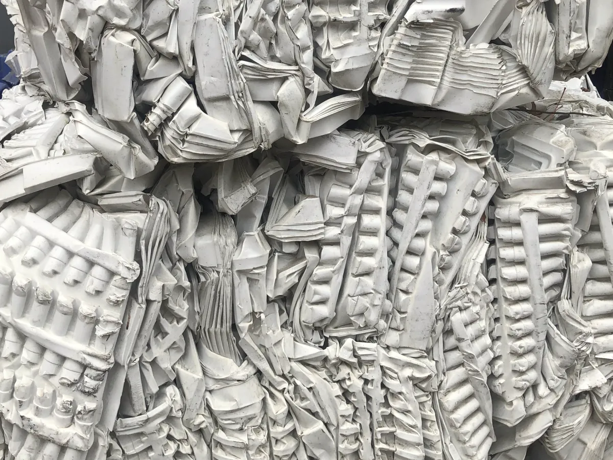Compressed bales of white plastic manufacturing waste ready for recycling